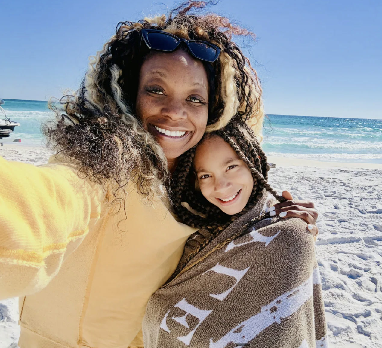 Tiffany Orner, U.S. Air Force veteran and founder of The TO Agency, on the beach with her daughter on Florida's Emerald Coast.