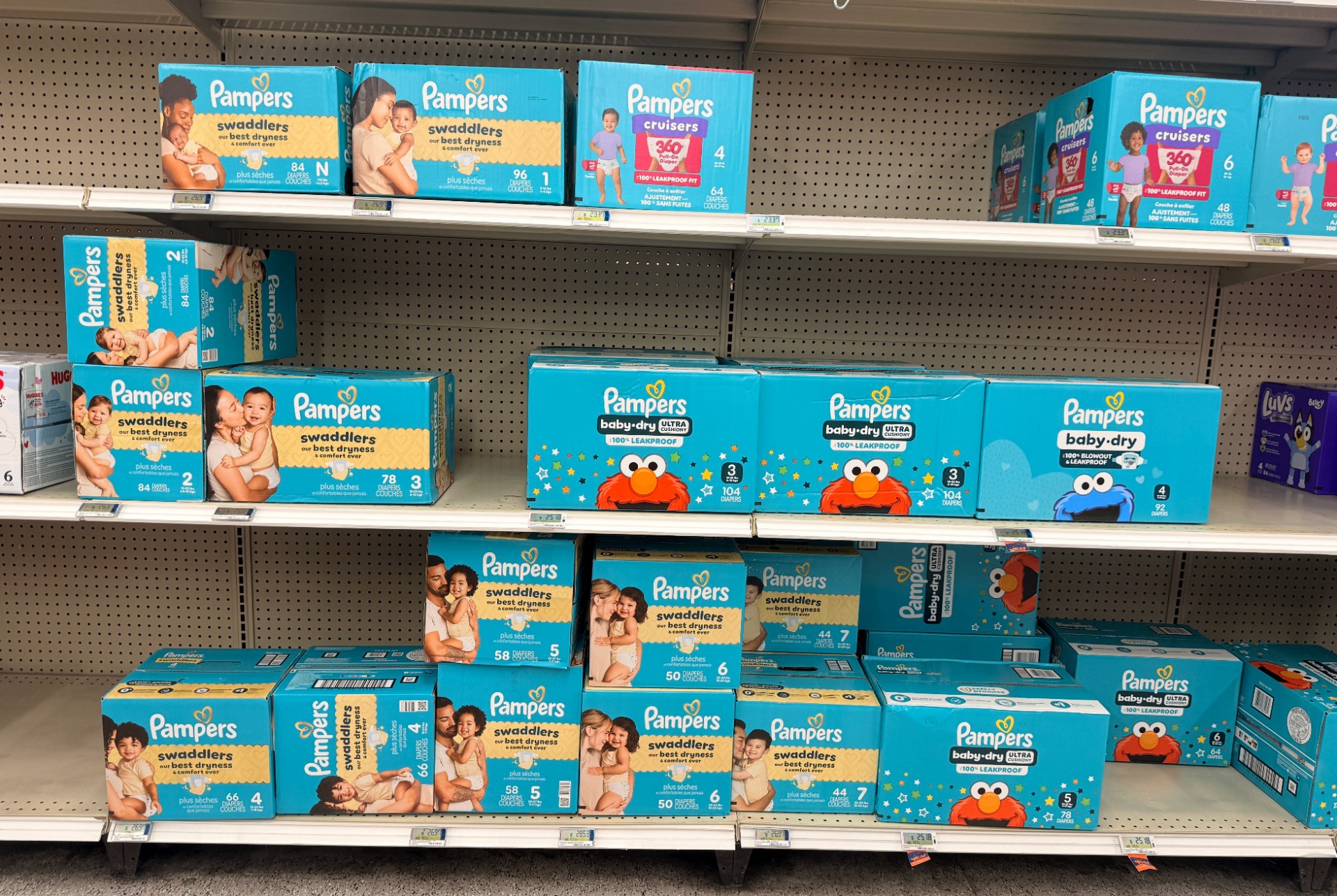 Shelves of diapers in a range of sizes at a military commissary, featured in a complete guide to diapering for military families.