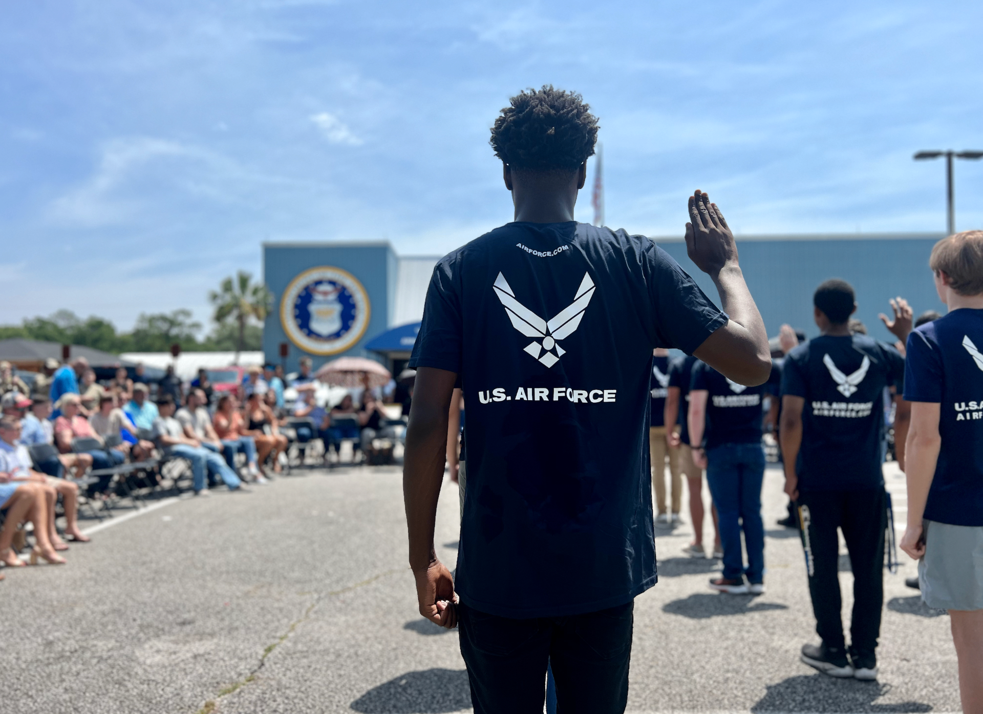 Future airmen taking the oath of enlistment at a U.S. Air Force ceremony, featured in a guide to whether you get free diapers in the military.