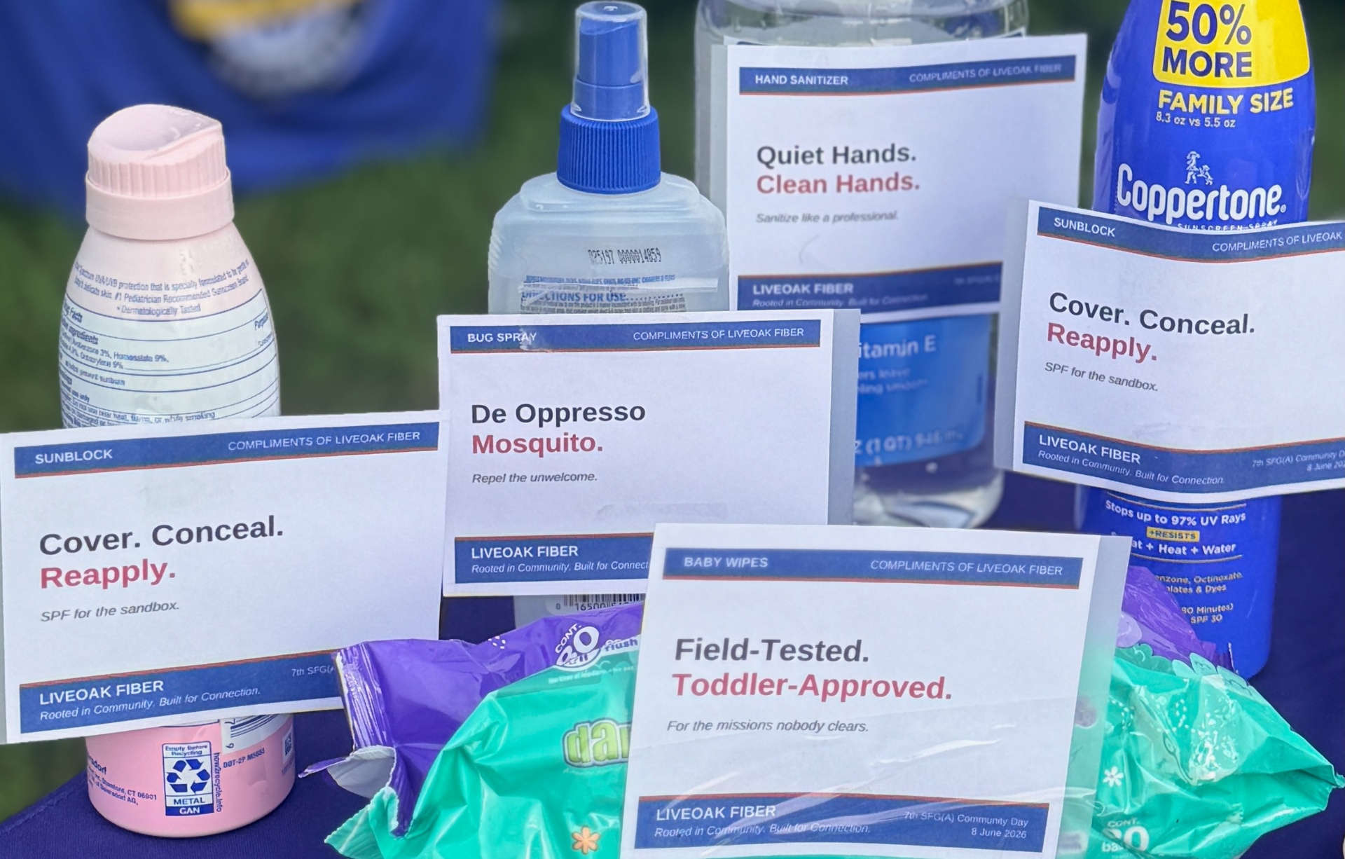 Baby wipes, sunblock, bug spray, and hand sanitizer at a military family event, featured in a diaper bag checklist for parents.
