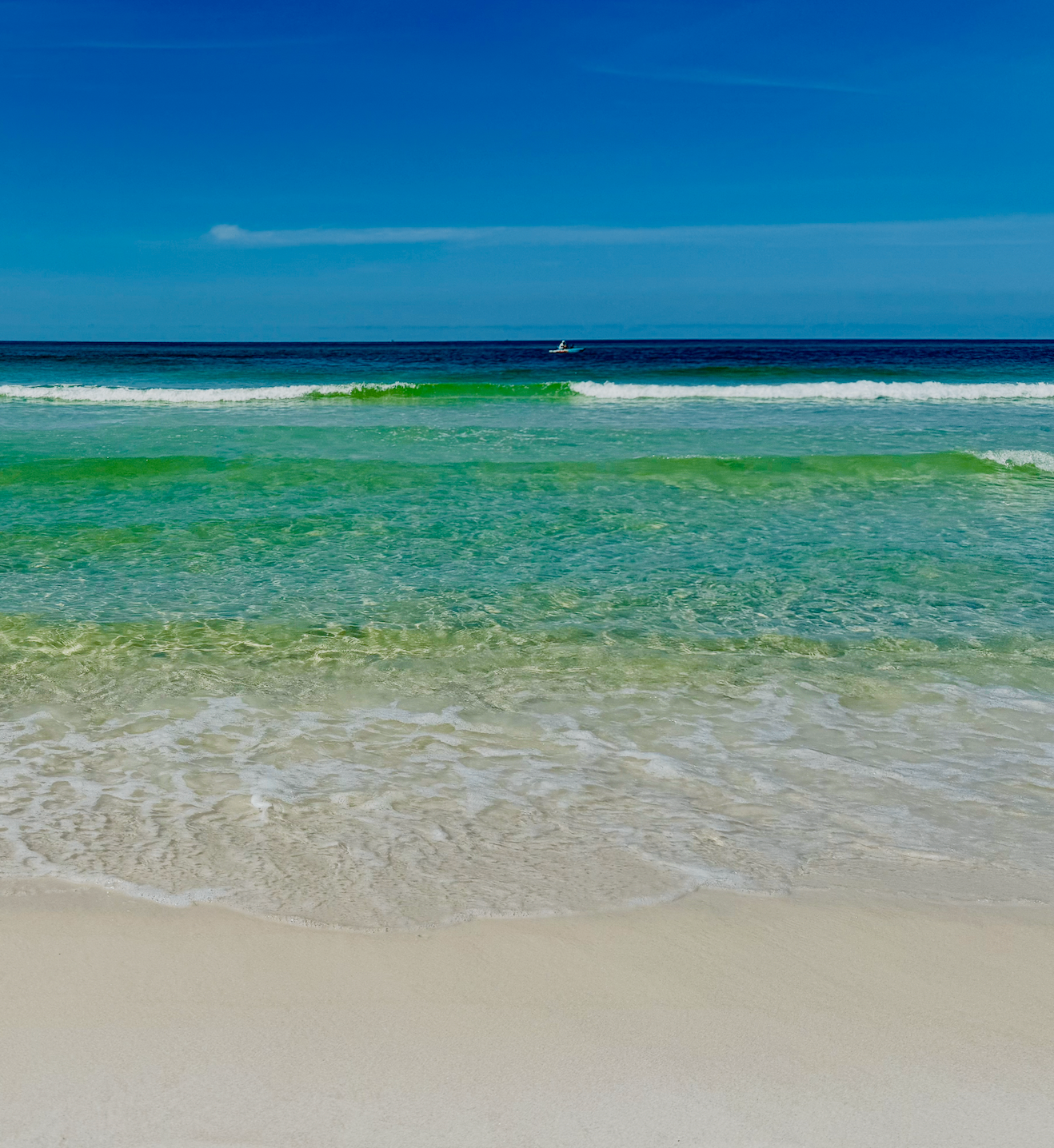 Calm emerald-green water on Florida's Emerald Coast, featured in a complete guide to potty training a special needs child.