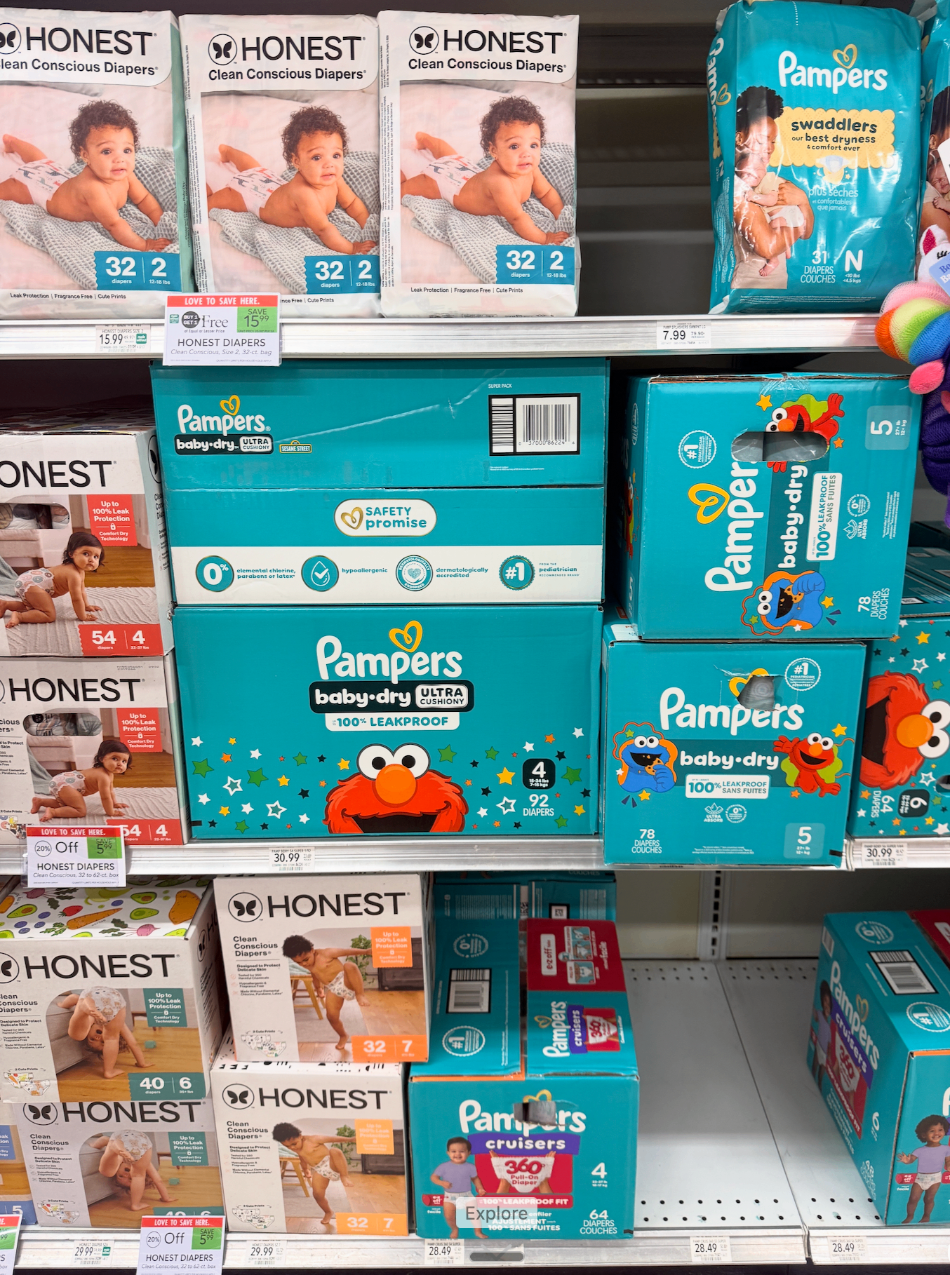Boxes and packs of diapers on a store shelf, featured in a guide to what happens if your child runs out of diapers at the CDC.