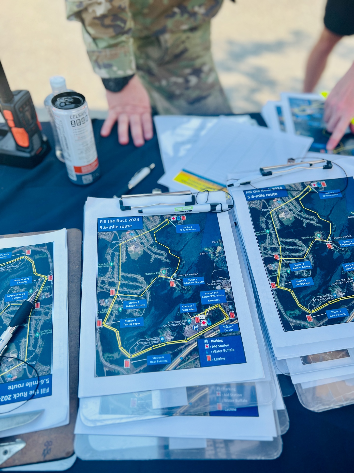 Printed route maps at a military community event, featured in a guide to handling diapers during a PCS move.
