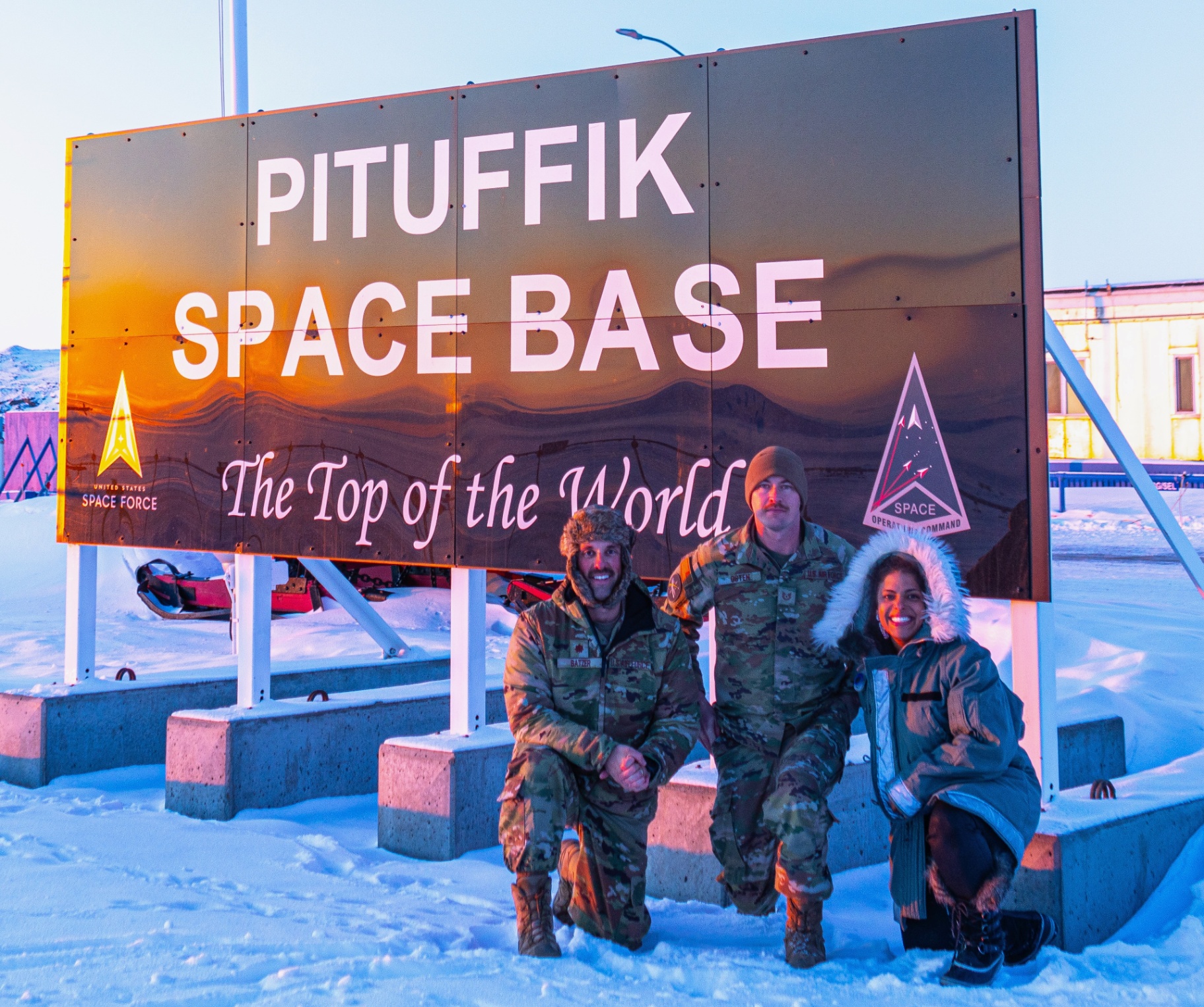 Tiffany Orner of The TO Agency with two service members at Pituffik Space Base, featured in a guide to Space Force family support.