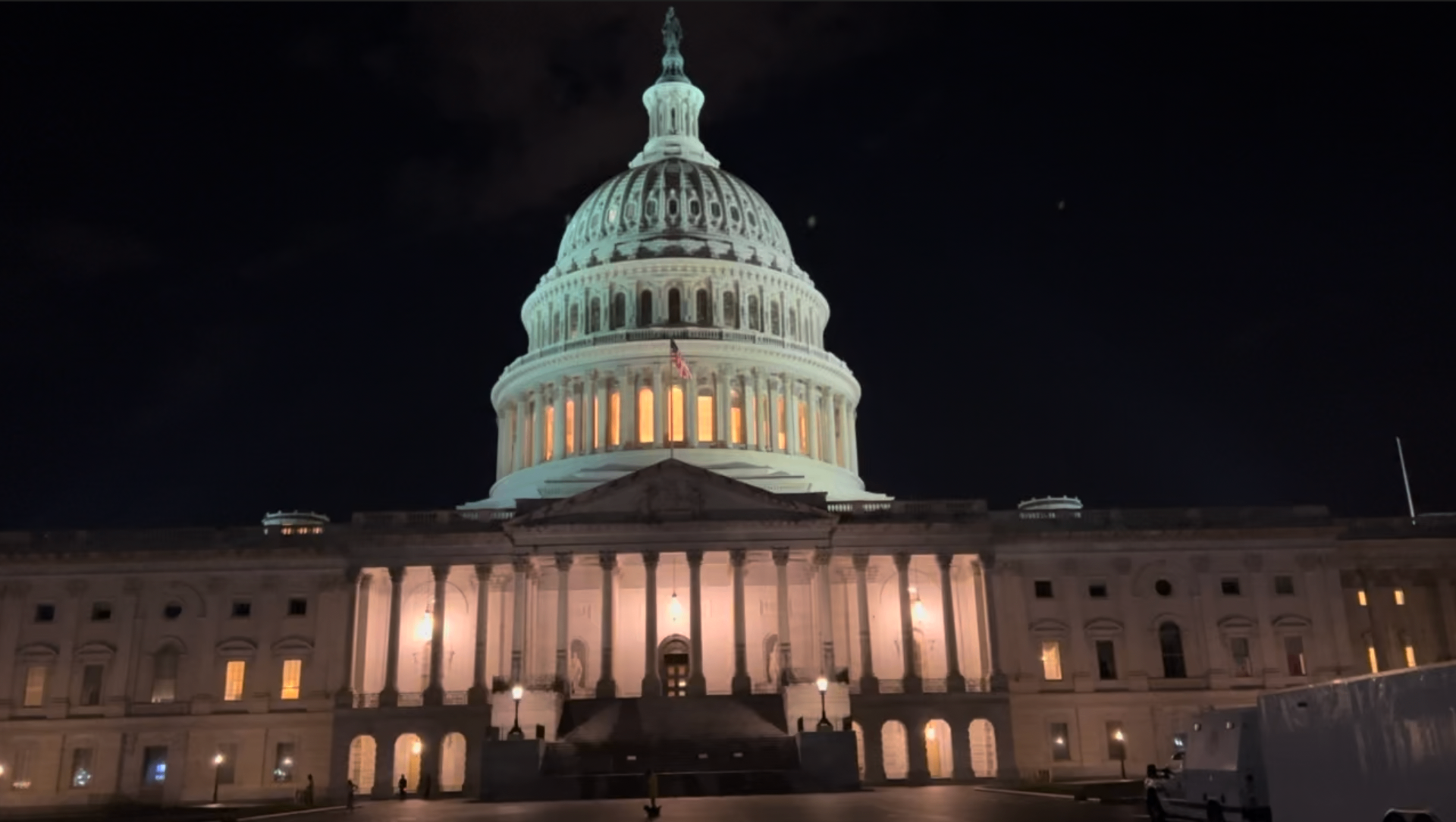 The U.S. Capitol at night, featured in a guide to getting diapers during a government shutdown or a pay gap.